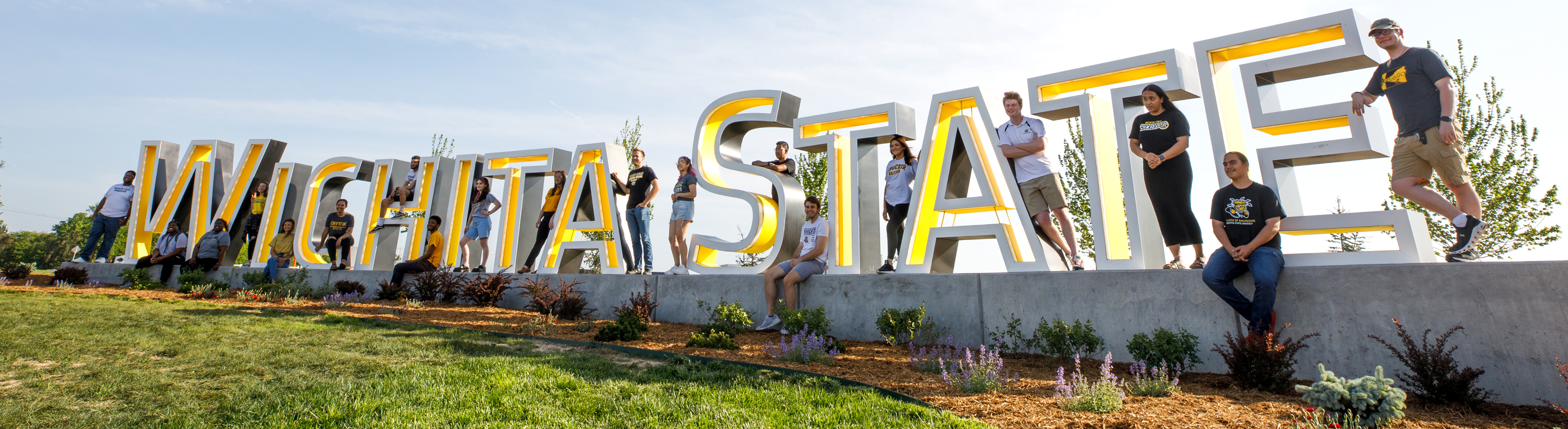 Shocker Students on the Wichita State Sign